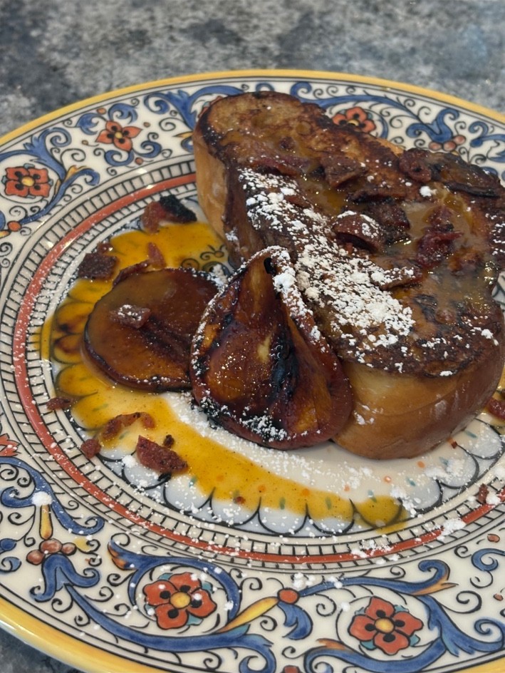 French toast with caramelized fruit and powdered sugar