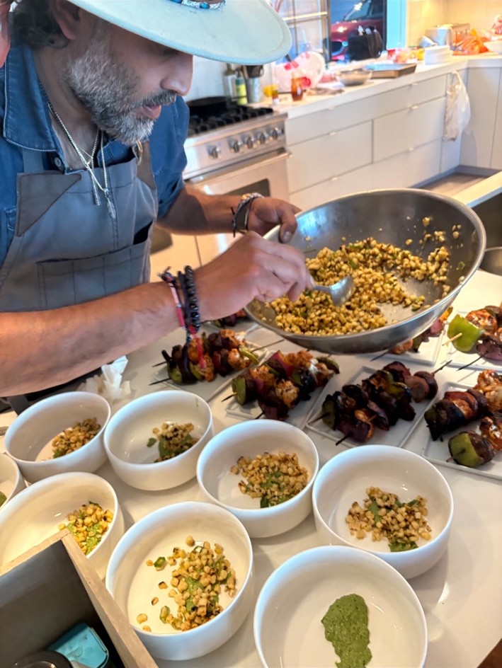 Head Chef Ronish Patel carefully plating food in a client’s kitchen