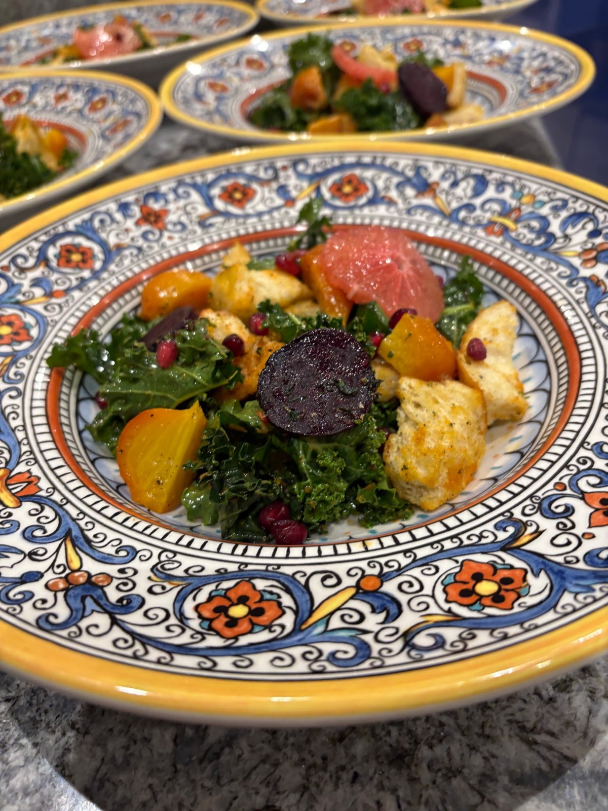 Seasonal salad with leafy greens, colorful beets, citrus and croutons